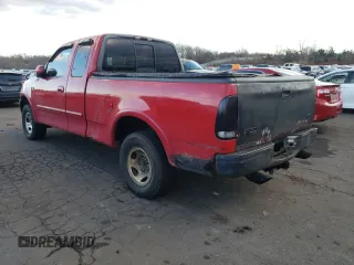 2000 Ford F-150 XL with VIN 1FTRX18W6YNC32005, listed as a Copart auction lot 82169314 with 289,320 mi miles and Salvage Title. Bid and sale history available at carsss.com. Image 2.
