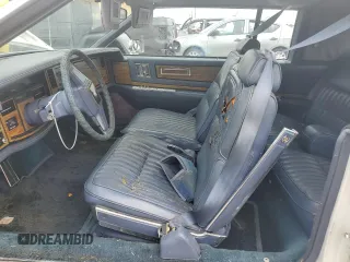 1984 Cadillac Eldorado z VIN 1G6AL5783EE654296, wystawiony jako Copart lot #74945374 z przebiegiem 37 040 mil mil oraz Szkody całkowita. Historia ofert i sprzedaży dostępna na DreamBid. Obrazek 7.