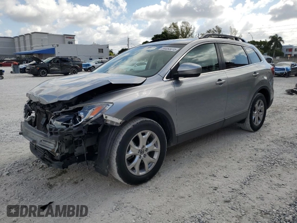 2015 Mazda CX-9 Touring with VIN JM3TB2CA1F0467659, listed as a Copart auction lot 56553015 with 102,028 mi miles and Salvage Title. Bid and sale history available at DreamBid. Image 1.