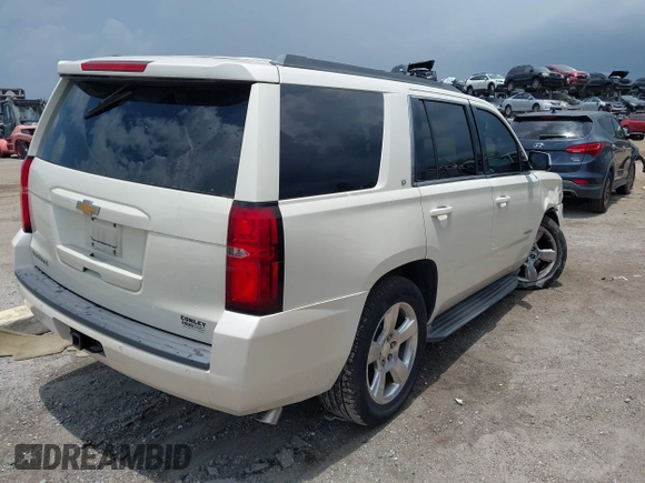 2015 Chevrolet Tahoe LT with VIN 1GNSCBKC0FR739951, listed as a IAAI auction lot 42332982 with 133,046 mi miles and . Bid and sale history available at DreamBid. Image 4.