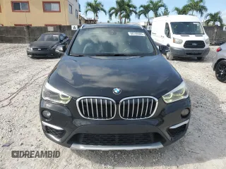 2019 BMW X1 xDrive28i with VIN WBXHT3C59K5L36435, listed as a Copart auction lot 60189985 with 105,110 mi miles and Salvage title. Bid and sale history available at DreamBid. Image 5.