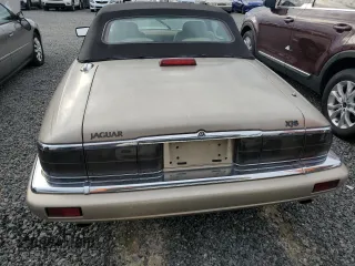1995 Jaguar XJS with VIN SAJNX2747SC196723, listed as a Copart auction lot 74147364 with 70,138 mi miles and Salvage Title. Bid and sale history available at carsss.com. Image 6.