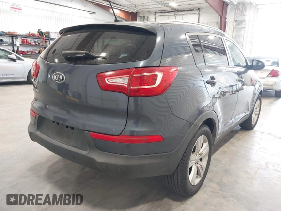 2011 Kia Sportage LX z VIN KNDPBCA21B7152695, wystawiony jako IAAI lot #41877774 z przebiegiem 306 540 mil mil oraz . Historia ofert i sprzedaży dostępna na DreamBid. Obrazek 4.
