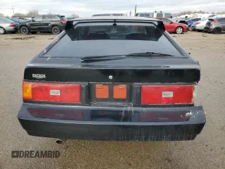1983 Toyota Supra z VIN JT2MA67L9D0056034, wystawiony jako Copart lot #82382484 z przebiegiem 39 338 mil mil oraz Szkoda całkowita • Salvage title. Historia ofert i sprzedaży dostępna na DreamBid. Obrazek 6.