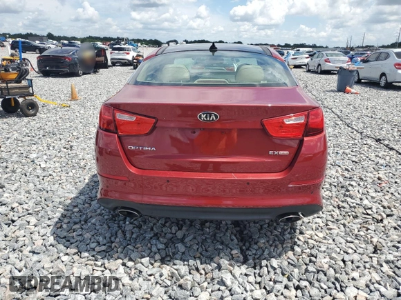 2015 Kia Optima EX с VIN 5XXGN4A70FG389927, выставлен на аукционе Copart как лот 60199955 с пробегом 96 389 миль миль и Списание • Salvage title. История ставок и продаж доступна на DreamBid. Изображение 6.
