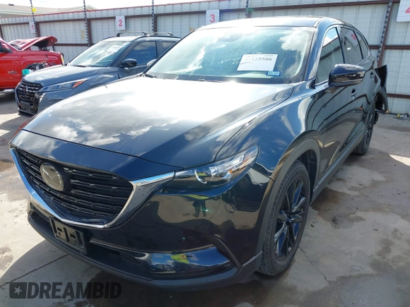 2023 Mazda CX-9 Touring Plus with VIN JM3TCBAY2P0657761, listed as a IAAI auction lot 41125586 with 12,425 mi miles and . Bid and sale history available at DreamBid. Image 22.