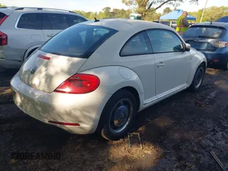2012 Volkswagen Beetle 2.5L w/Sound/Nav PZEV with VIN 3VWJP7AT1CM619318, listed as a IAAI auction lot 42223291 with 85,989 mi miles and . Bid and sale history available at DreamBid. Image 4.