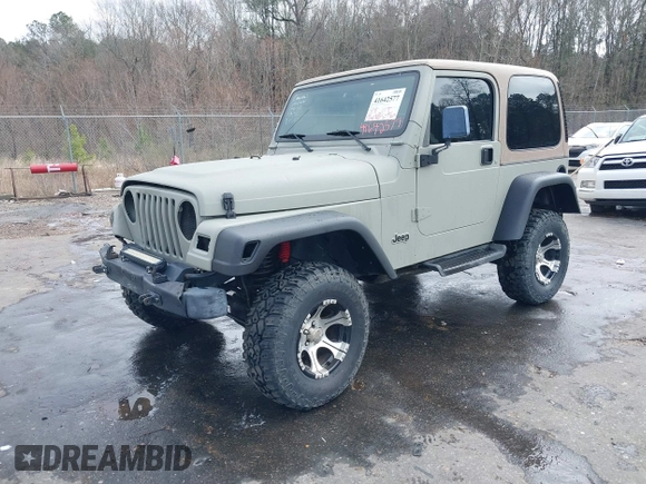 1999 Jeep Wrangler Sahara with VIN 1J4FY49S0XP480017, listed as a IAAI auction lot 41642577 with 154,068 mi miles. Bid and sale history available at carsss.com. Image 17.