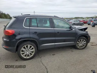 2014 Volkswagen Tiguan S z VIN WVGBV3AX5EW554500, wystawiony jako Copart lot #57016775 z przebiegiem 91 101 mil mil oraz Szkoda całkowita • Salvage title. Historia ofert i sprzedaży dostępna na DreamBid. Obrazek 3.