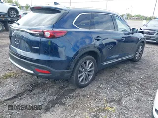2021 Mazda CX-9 Grand Touring with VIN JM3TCBDY3M0537975, listed as a IAAI auction lot 42251894 with 50,156 mi miles and . Bid and sale history available at DreamBid. Image 4.