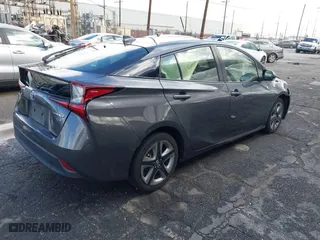 2022 Toyota Prius L Eco with VIN JTDKAMFU7N3155268, listed as a IAAI auction lot 41589024 with 158,430 mi miles. Bid and sale history available at carsss.com. Image 4.