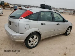 2004 Ford Focus with VIN 3FAFP37Z14R102723, listed as a Copart auction lot 44138195 with 220,354 mi miles and Salvage title. Bid and sale history available at DreamBid. Image 3.