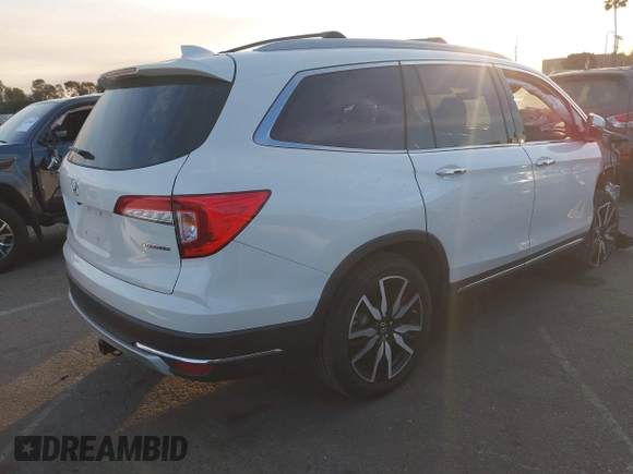 2019 Honda Pilot Touring 8-Passenger with VIN 5FNYF5H97KB005203, listed as a IAAI auction lot 41399930 with 47,267 mi miles and . Bid and sale history available at DreamBid. Image 4.