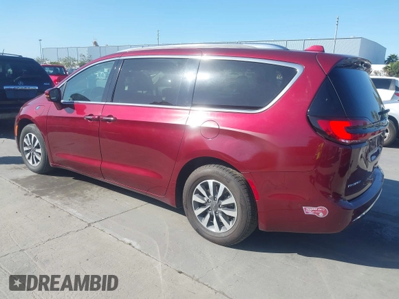 2021 Chrysler Pacifica Hybrid Touring L with VIN 2C4RC1L76MR581285, listed as a IAAI auction lot 42303222 with 77,808 mi miles and . Bid and sale history available at DreamBid. Image 3.