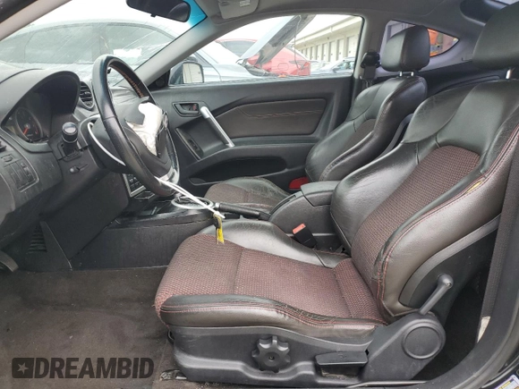 2006 Hyundai Tiburon GT z VIN KMHHN65F66U215304, wystawiony jako Copart lot #56141635 z przebiegiem 149 118 mil mil oraz Szkoda całkowita • Salvage title. Historia ofert i sprzedaży dostępna na DreamBid. Obrazek 7.