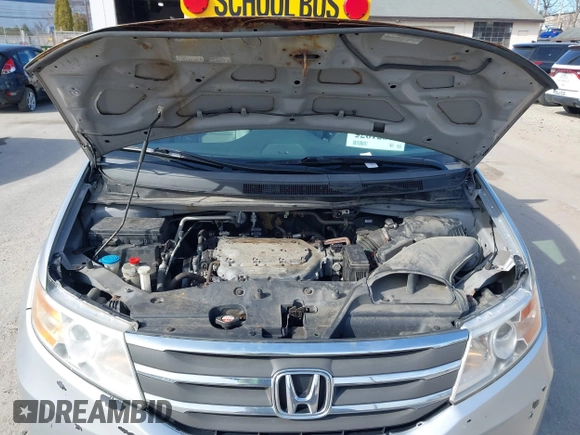 2012 Honda Odyssey Touring with VIN 5FNRL5H95CB063003, listed as a IAAI auction lot 41871975 with 179,332 mi miles and . Bid and sale history available at DreamBid. Image 10.