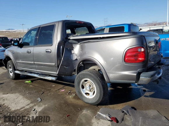 2003 Ford F-150 XLT with VIN 1FTRW08673KA38056, listed as a Copart auction lot 42772435 with 129,104 mi miles and Salvage Title. Bid and sale history available at carsss.com. Image 2.