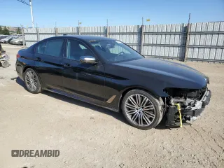 2019 BMW 5 Series M550i xDrive with VIN WBAJB9C50KB464503, listed as a Copart auction lot 56995825 with 67,324 mi miles and Salvage title. Bid and sale history available at DreamBid. Image 4.