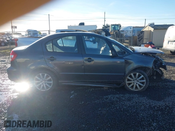 2010 Suzuki SX4 with VIN JS2YC5A40A6300053, listed as a IAAI auction lot 41392061 with 114,863 mi miles and . Bid and sale history available at DreamBid. Image 13.