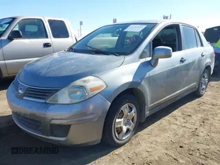 2007 Nissan Versa 1.8 SL with VIN 3N1BC11E37L432291, listed as a IAAI auction lot 41357144 with 136,039 mi miles. Bid and sale history available at carsss.com. Image 2.