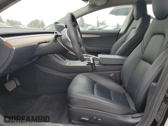 2023 Tesla Model 3 z VIN 5YJ3E1EA7PF600239, wystawiony jako Copart lot #56557705 z przebiegiem 18 851 mil mil oraz Szkoda całkowita • Salvage title. Historia ofert i sprzedaży dostępna na DreamBid. Obrazek 7.