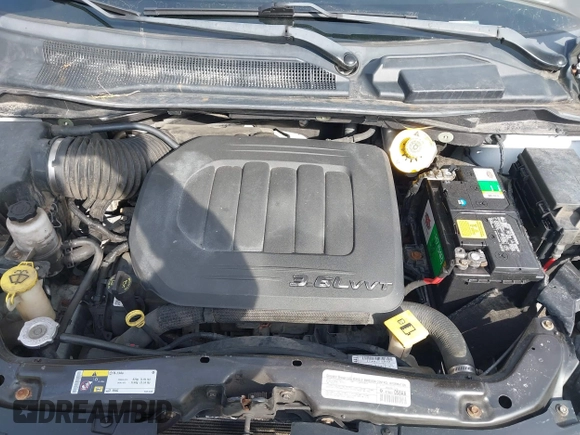 2014 Dodge Grand Caravan American Value with VIN 2C4RDGBG4ER227493, listed as a IAAI auction lot 41651263 with 206,169 mi miles and . Bid and sale history available at DreamBid. Image 10.