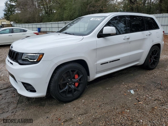2021 Jeep Grand Cherokee SRT with VIN 1C4RJFDJ1MC561144, listed as a Copart auction lot 83961214 with 49,989 mi miles and Salvage Title. Bid and sale history available at carsss.com. Image 1.