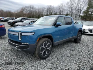 2024 Rivian R1T Adventure z VIN 7FCTGCAA7RN030866, wystawiony jako Copart lot #52406415 z przebiegiem 12 066 mil mil oraz Szkoda całkowita • Salvage title. Historia ofert i sprzedaży dostępna na DreamBid. Obrazek 1.