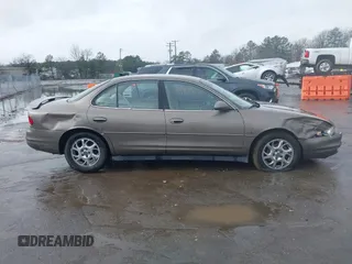 2000 Oldsmobile Intrigue GLS z VIN 1G3WX52H9YF131166, wystawiony jako IAAI lot #41527895 z przebiegiem 104 534 mil mil oraz . Historia ofert i sprzedaży dostępna na DreamBid. Obrazek 13.