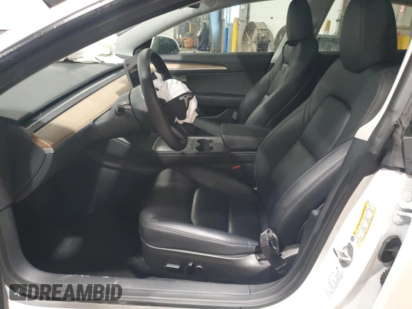 2023 Tesla Model 3 with VIN 5YJ3E1EA6PF588701, listed as a Copart auction lot 61446355 with Not provided miles and Salvage title. Bid and sale history available at DreamBid. Image 7.