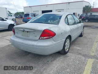 2006 Ford Taurus SE with VIN 1FAFP53U56A209213, listed as a IAAI auction lot 42009423 with 118,083 mi miles. Bid and sale history available at carsss.com. Image 4.