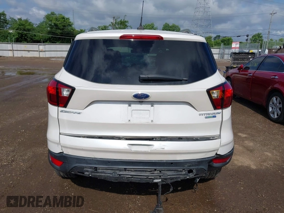 2019 Ford Escape Titanium with VIN 1FMCU9J98KUA95238, listed as a IAAI auction lot 42525324 with 59,222 mi miles and . Bid and sale history available at DreamBid. Image 16.