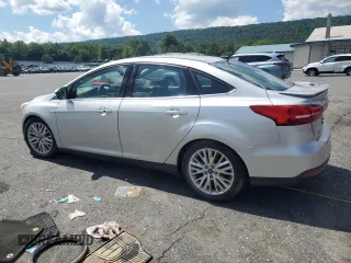 2015 Ford Focus Titanium with VIN 1FADP3J27FL267339, listed as a Copart auction lot 63395835 with 73,372 mi miles and Salvage title. Bid and sale history available at DreamBid. Image 2.