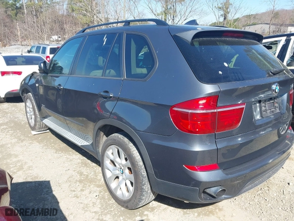 2011 BMW X5 35i with VIN 5UXZV4C51BL740731, listed as a IAAI auction lot 41771257 with 148,638 mi miles. Bid and sale history available at carsss.com. Image 3.