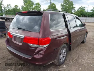 2009 Honda Odyssey Touring with VIN 5FNRL38929B037150, listed as a IAAI auction lot 42319657 with 183,663 mi miles and . Bid and sale history available at DreamBid. Image 4.