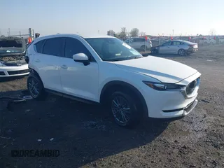 2019 Mazda CX-5 Touring z VIN JM3KFACM0K1564330, wystawiony jako IAAI lot #41797276 z przebiegiem 112 100 mil mil oraz . Historia ofert i sprzedaży dostępna na DreamBid. Obrazek 1.