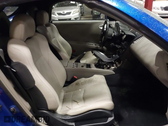 2005 Nissan 350Z Touring z VIN JN1AZ36A95M753704, wystawiony jako IAAI lot #41226946 z przebiegiem 94 351 mil mil oraz . Historia ofert i sprzedaży dostępna na DreamBid. Obrazek 5.