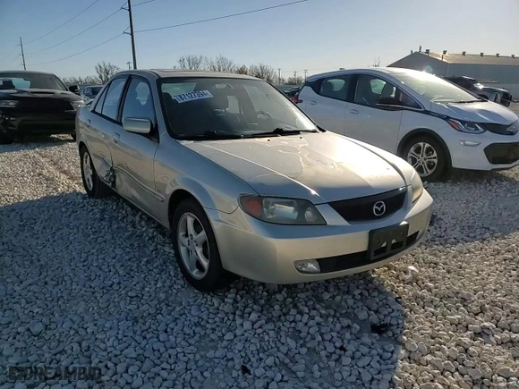 2002 Mazda Protege DX with VIN JM1BJ225621563187, listed as a Copart auction lot 87127394 with 121,642 mi miles and Salvage Title. Bid and sale history available at carsss.com. Image 10.