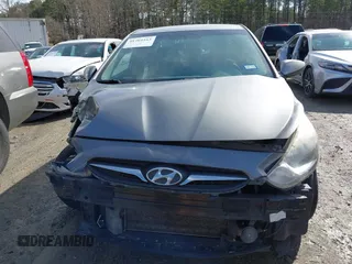 2014 Hyundai Accent GLS with VIN KMHCT4AEXEU710606, listed as a IAAI auction lot 41764163 with 103,859 mi miles. Bid and sale history available at carsss.com. Image 12.
