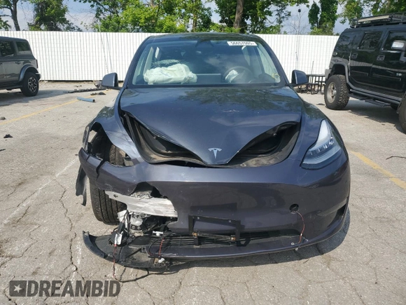 2023 Tesla Model Y Long Range z VIN 7SAYGDEE2PA041350, wystawiony jako Copart lot #56657005 z przebiegiem 25 090 mil mil oraz Szkoda całkowita • Salvage title. Historia ofert i sprzedaży dostępna na DreamBid. Obrazek 5.