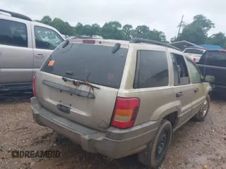 2003 Jeep Grand Cherokee Laredo z VIN 1J4GW48S33C599693, wystawiony jako IAAI lot #42228885 z przebiegiem 257 551 mil mil oraz . Historia ofert i sprzedaży dostępna na DreamBid. Obrazek 4.