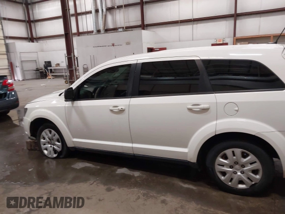 2015 Dodge Journey American Value z VIN 3C4PDCAB4FT714200, wystawiony jako IAAI lot #42199910 z przebiegiem 205 009 mil mil oraz . Historia ofert i sprzedaży dostępna na DreamBid. Obrazek 14.