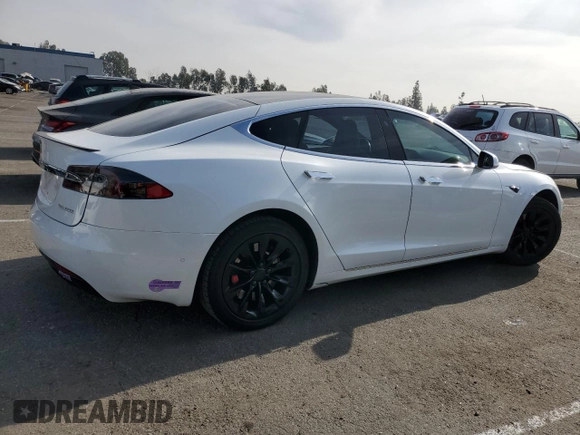 2019 Tesla Model S 100D with VIN 5YJSA1E44KF335113, listed as a Copart auction lot 82936844 with 89,770 mi miles and Salvage title. Bid and sale history available at DreamBid. Image 3.