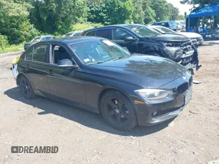 2014 BMW 3 Series 320i xDrive with VIN WBA3C3G51ENS70935, listed as a IAAI auction lot 39754065 with 233,973 mi miles. Bid and sale history available at carsss.com. Image 1.