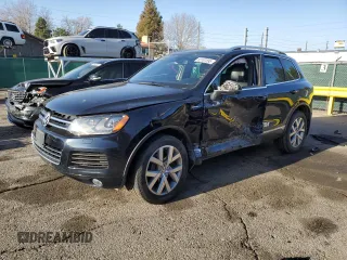 2014 Volkswagen Touareg X z VIN WVGEP9BP5ED008560, wystawiony jako Copart lot #52767595 z przebiegiem Nie podano mil oraz Szkoda całkowita • Salvage title. Historia ofert i sprzedaży dostępna na DreamBid. Obrazek 1.