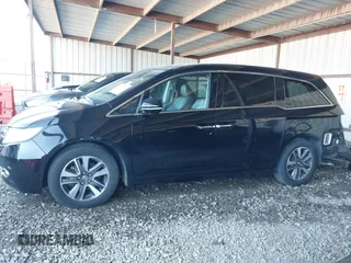 2014 Honda Odyssey Touring with VIN 5FNRL5H94EB110590, listed as a IAAI auction lot 42092929 with 242,338 mi miles and . Bid and sale history available at DreamBid. Image 15.