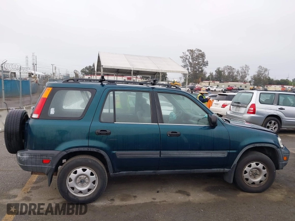 1998 Honda CR-V LX z VIN JHLRD1749WC068852, wystawiony jako IAAI lot #41915089 z przebiegiem 241 163 mil mil oraz . Historia ofert i sprzedaży dostępna na DreamBid. Obrazek 13.