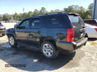 2011 GMC Yukon SLE with VIN 1GKS1AE02BR213992, listed as a Copart auction lot 75609704 with 133,536 mi miles and Salvage Title. Bid and sale history available at carsss.com. Image 2.