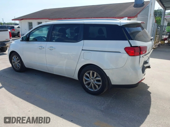 2021 Kia Sedona LX with VIN KNDMB5C12M6661917, listed as a IAAI auction lot 42129682 with 80,321 mi miles and . Bid and sale history available at carsss.com. Image 3.