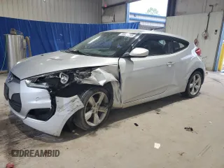 2013 Hyundai Veloster w/Black Int z VIN KMHTC6AD9DU129910, wystawiony jako Copart lot #56829285 z przebiegiem 87 067 mil mil oraz Szkoda całkowita • Salvage title. Historia ofert i sprzedaży dostępna na DreamBid. Obrazek 1.